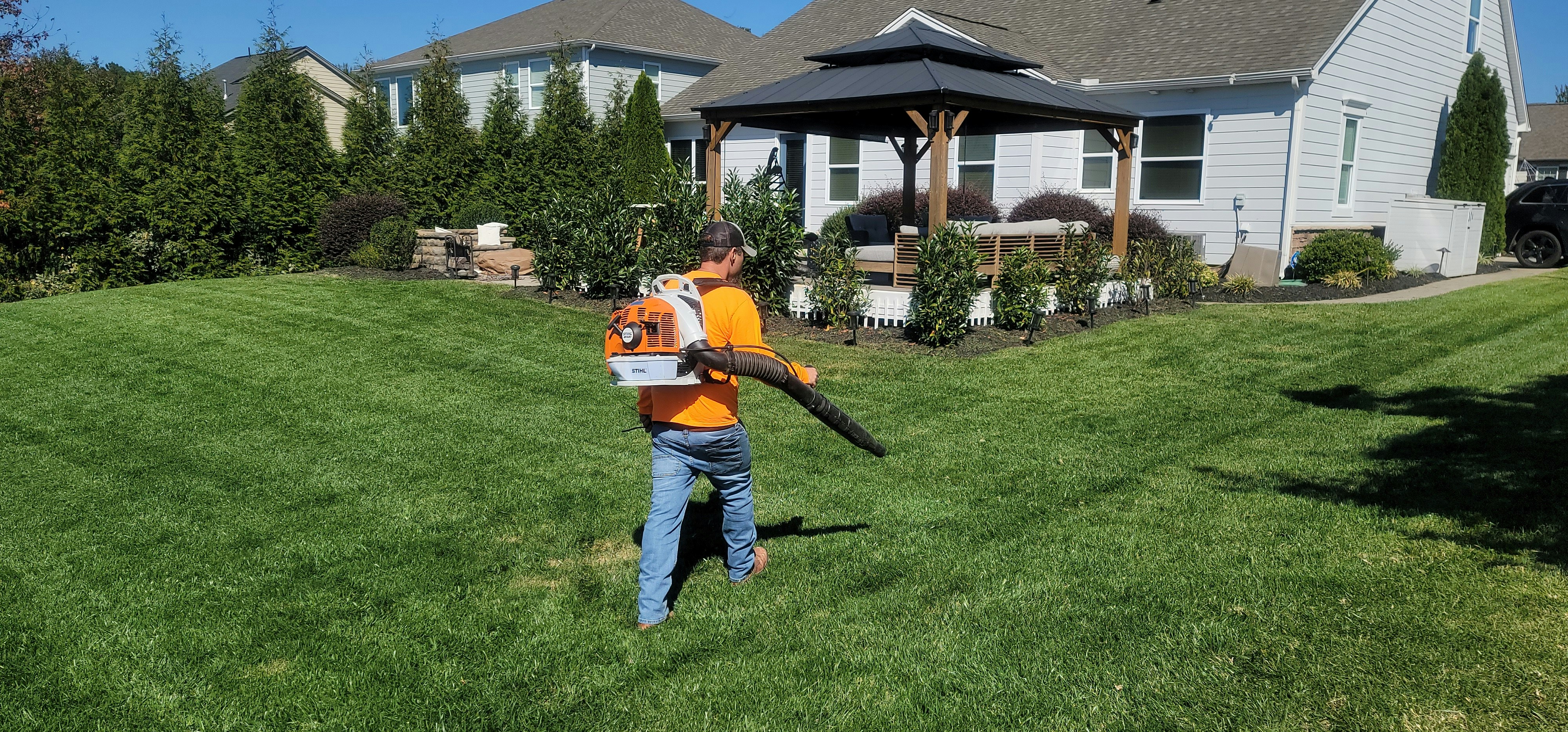 Crew maintaining a manicured lawn